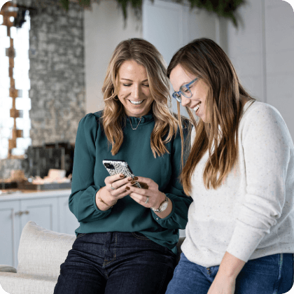Who We Are 4 - Two people looking at same phone